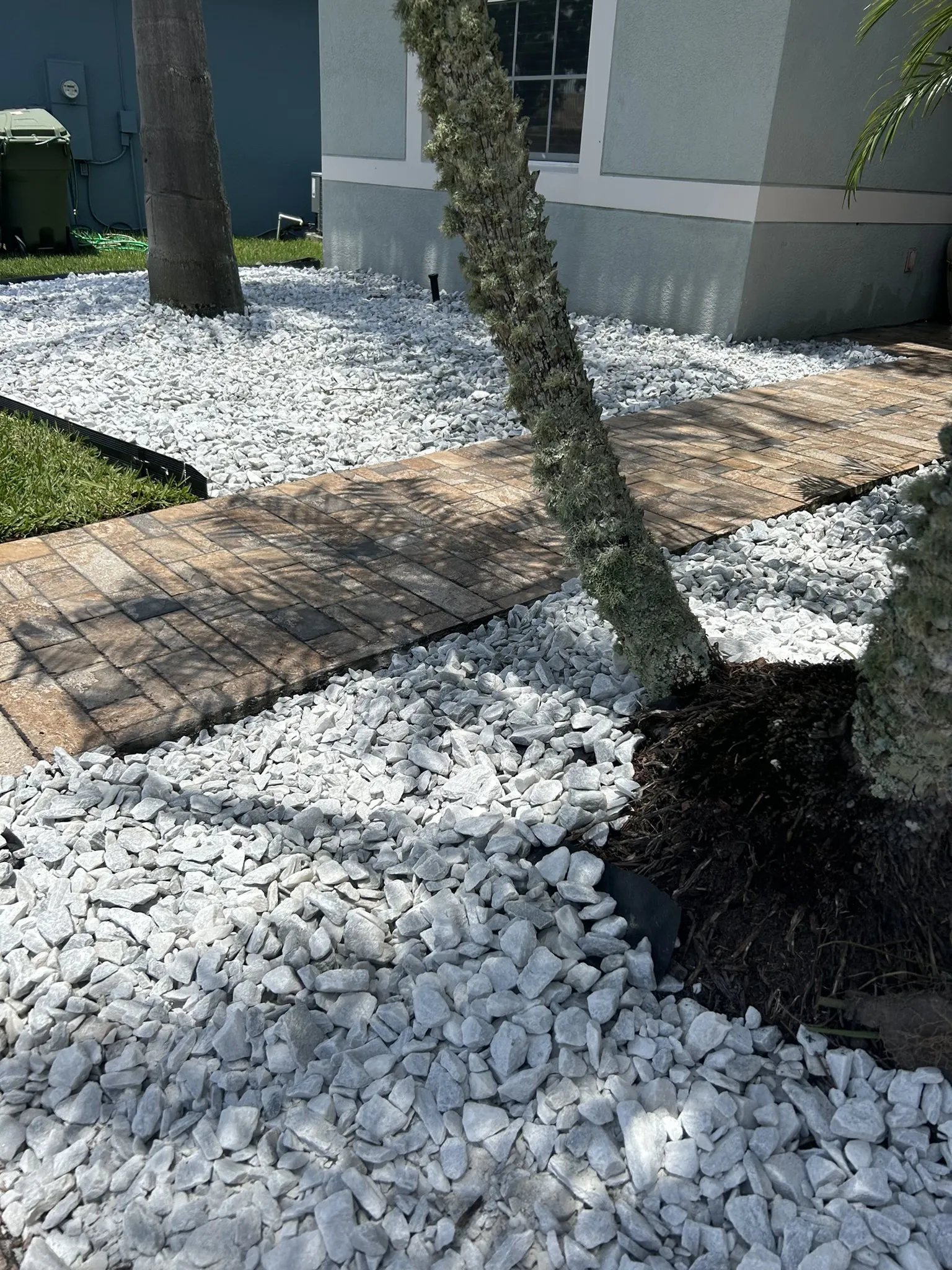 Modern Sprinkler System A modern sprinkler system efficiently waters the plants and grass in a residential yard.