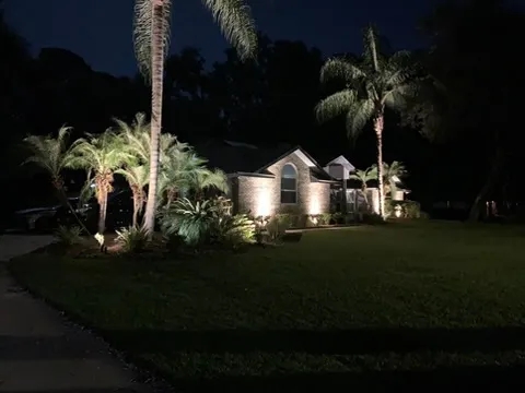 A well-lit landscape can add beauty and security to your home. This picture shows an example of landscape lighting that has been installed around a house.